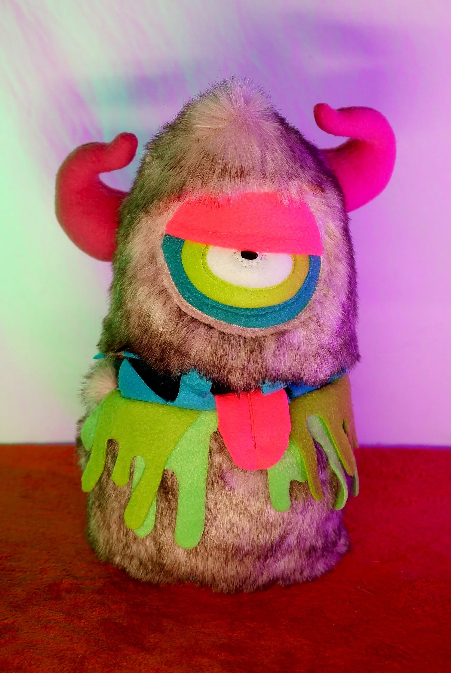 LARGE PINK ONE EYED MONSTER WITH HORNS, POCKET MOUTH & SLIME — TIM